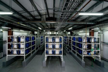 World's largest  flow battery system. Capable of storing and delivering grid power. The system consists of 72 cell stacks and six 12,000 gallon holding tanks behind them. The tanks hold   electrolyte that flows into and combines in the cell stacks. Converting chemical energy into electricity.